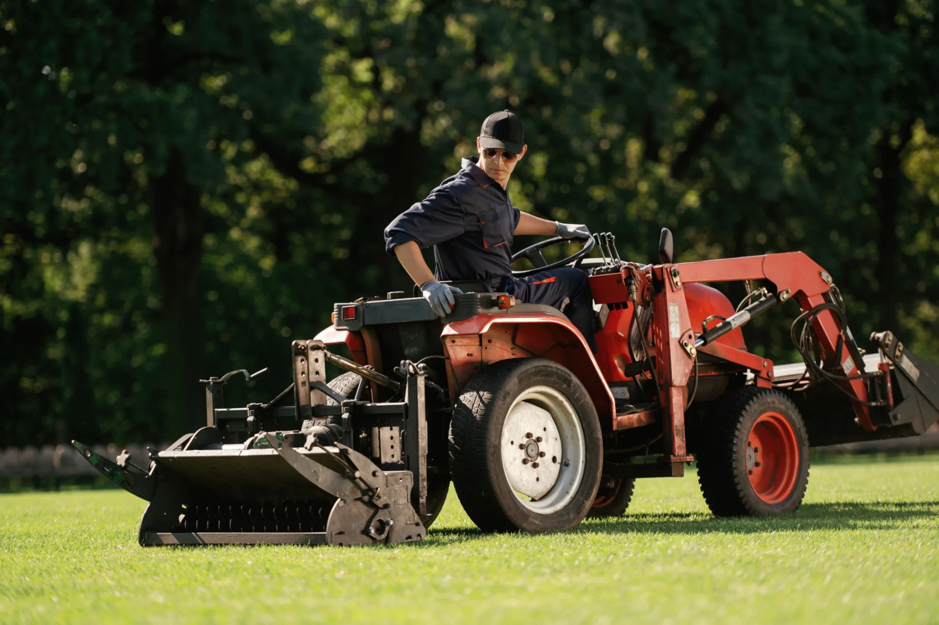 Man driving a utility tractor
